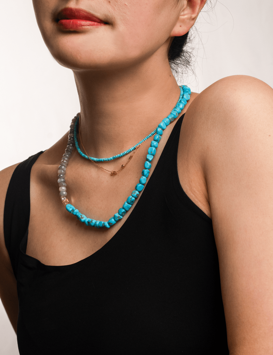 Model wearing New York Moonstone & Blue Turquoise faceted necklace, showcasing its serene color and elegant design.