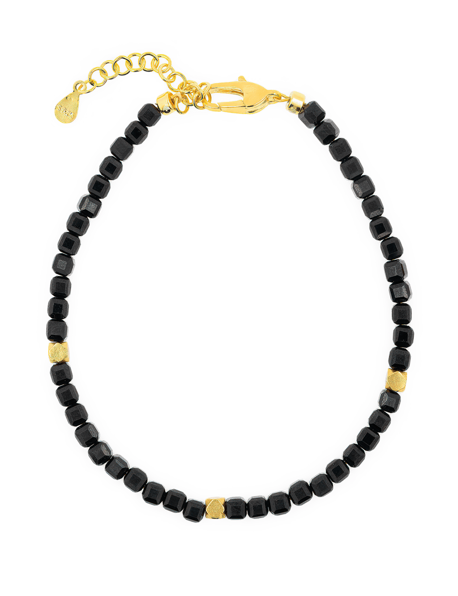 Black Tourmaline faceted bracelet with gold spacer beads, enhancing protection and emotional stability.