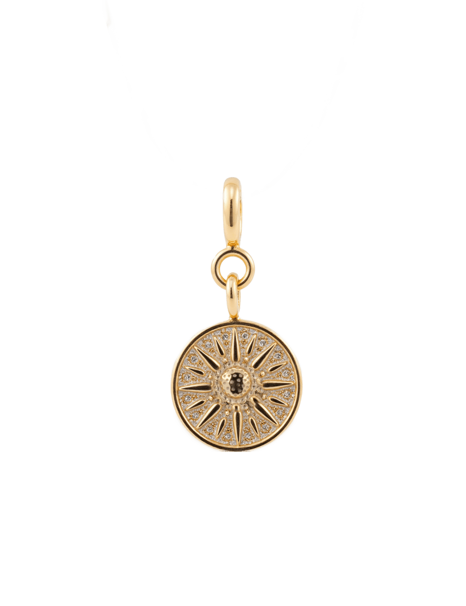 Gold sun charm with zircon embellishments, symbolizing protection, vitality, and positive energy.