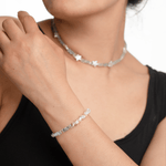 Model wearing AURA DUO Aquamarine Star Pearl Necklace and bracelet, showcasing their delicate design and star-shaped pearls.