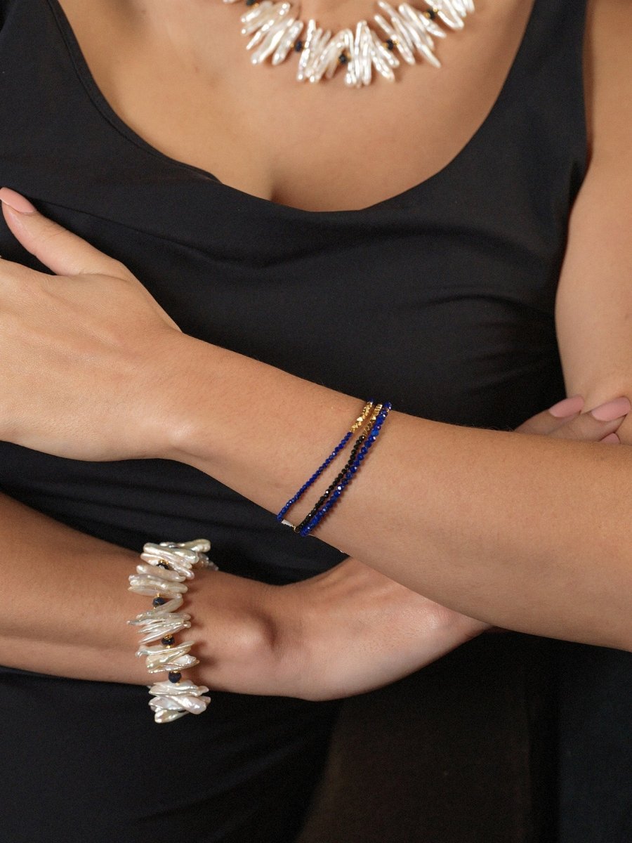 AURA DUO Black Opal Biwa-Style Stick Pearl Bracelet with spacer beads worn by model.