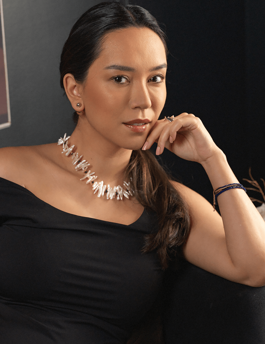 Elegant woman wearing AURA DUO black opal Biwa-style stick pearl necklace with spacer beads.