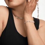 Woman wearing AURA DUO Gray Moonstone Star Pearl bracelet and matching necklace, showcasing celestial elegance and natural charm.