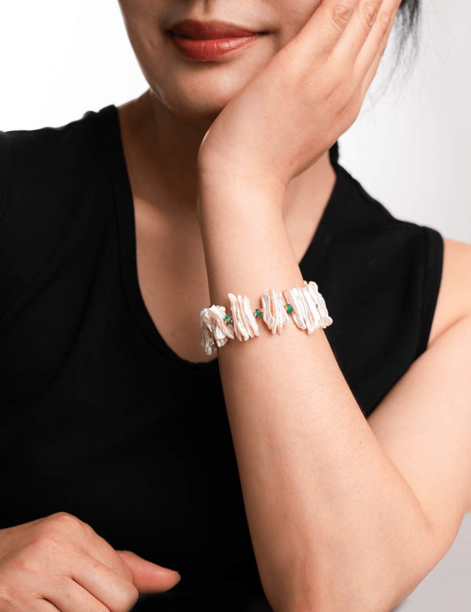 Model wearing a Biwa-style stick pearl bracelet with green agate and gold-plated sterling silver beads.