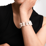Model wearing a Biwa-style stick pearl bracelet with green agate and gold-plated sterling silver beads.