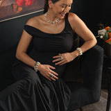 Woman in an elegant black dress modeling a Biwa-style stick pearl necklace, showcasing refined jewelry style.
