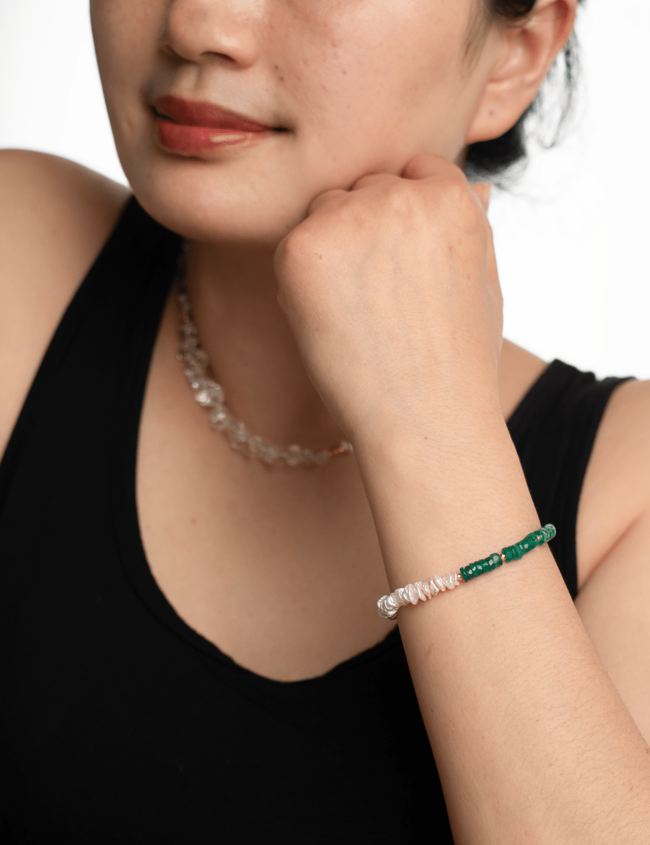 AURA DUO Green Agate Pearl Bracelet with Spacer Beads worn on a woman's wrist, showcasing elegance and harmony.