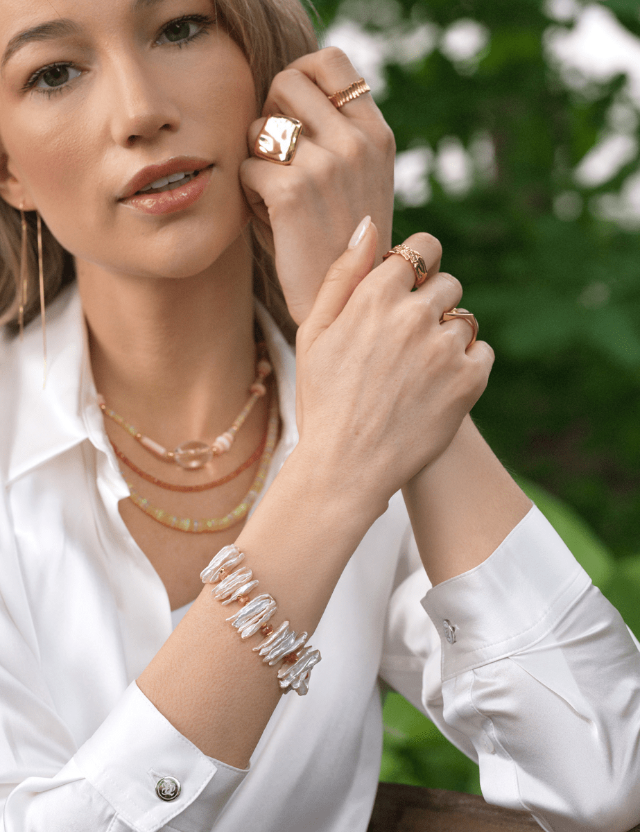 Model wearing BEAMMORE sunstone & elongated Biwa pearl beaded gold-plated sterling silver bracelet – Elegant birthstone jewelry gift for women
