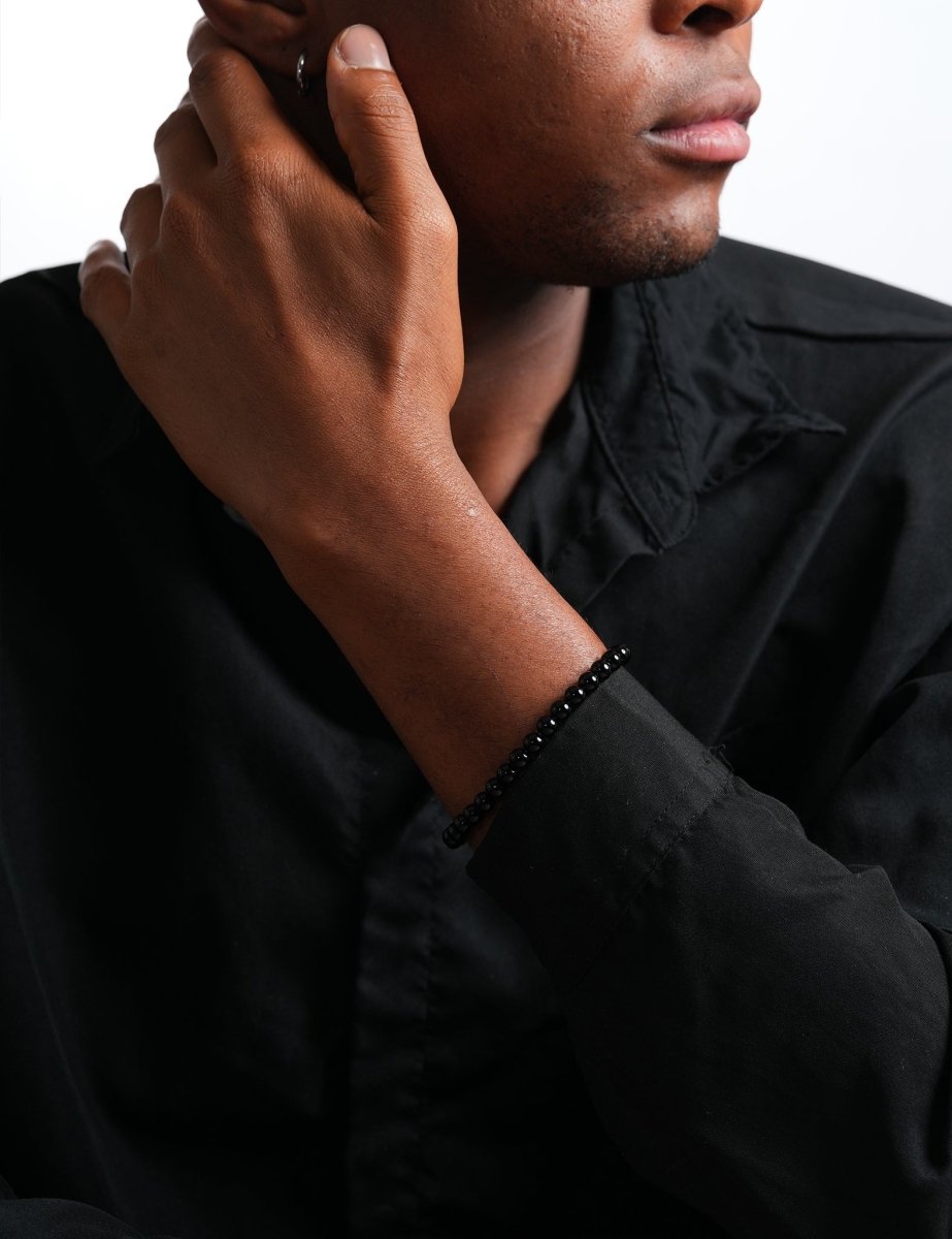 Model wearing BEAMMORE black onyx beaded bracelet – Elegant birthstone jewelry gift for men