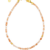 Dainty Sunstone bracelet with silver spacer beads, featuring a gold clasp and adjustable chain for a perfect fit.