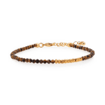Yellow Tiger’s Eye bracelet with silver spacer beads, promoting stability and inner strength.
