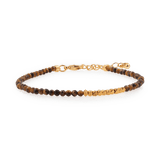 Yellow Tiger’s Eye bracelet with silver spacer beads, promoting stability and inner strength.