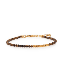 Yellow Tiger’s Eye bracelet with silver spacer beads, promoting stability and inner strength.