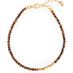 Yellow Tiger’s Eye bracelet with gold spacer beads, symbolizing confidence and stability.