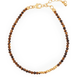 Yellow Tiger’s Eye bracelet with gold spacer beads, symbolizing confidence and stability.