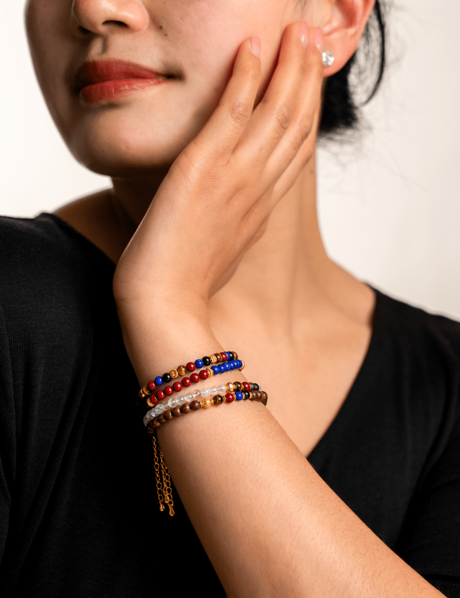 Model wearing BEAMMORE Zenith Pulse faceted black onyx, cinnabar & lapis lazuli beaded bracelet with spacer beads – Elegant jewelry gift for women