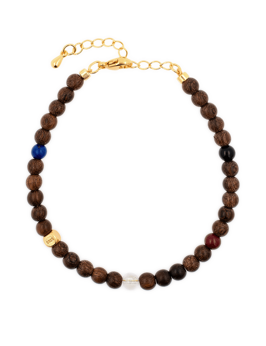 Five Elements Stellar Guardian Bracelet featuring wooden beads and Lapis Lazuli, Black Onyx, and Cinnabar accents.