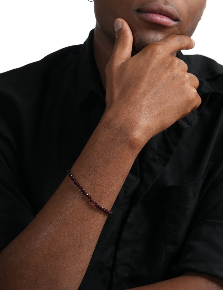 Model wearing BEAMMORE garnet faceted 4mm bracelet – Clean, modern style