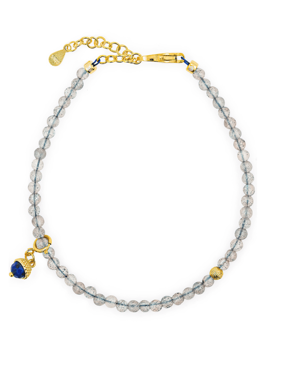Growth Gray Moonstone bracelet with silver spacer bead and Lapis Lazuli charm showcasing elegance and emotional balance.