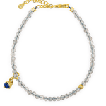 Growth Gray Moonstone bracelet with silver spacer bead and Lapis Lazuli charm showcasing elegance and emotional balance.