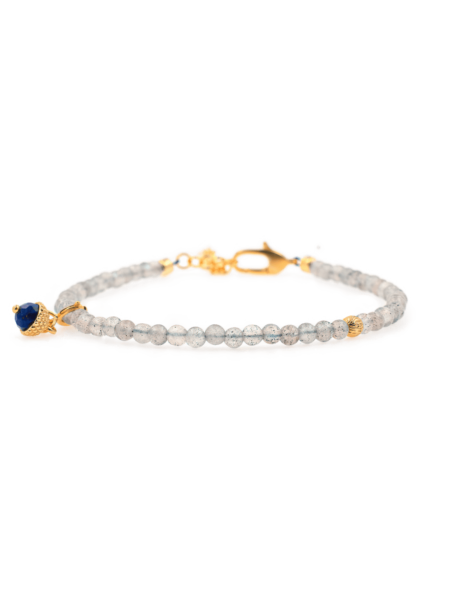 Dainty Gray Moonstone bracelet with silver spacer beads and Lapis Lazuli charm, promoting emotional balance and intuition.