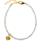 Gray Moonstone faceted bracelet with silver spacer beads and heart charm, symbolizing love and emotional balance.