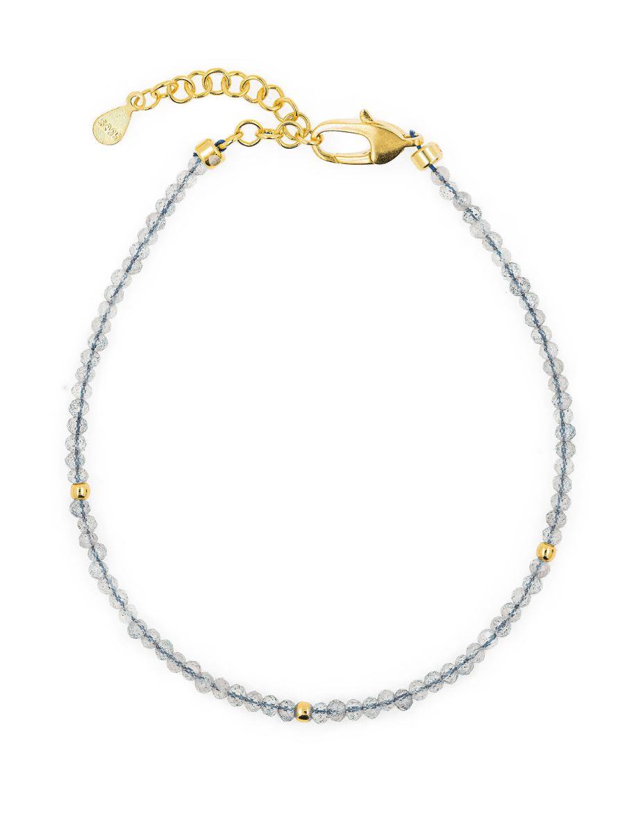 Growth Gray Moonstone bracelet with gold clasps and spacer beads, symbolizing balance and intuition.