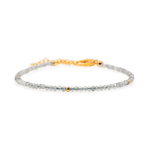 Dainty gray moonstone bracelet with silver spacer beads and gold accent, perfect for spiritual growth and elegance.