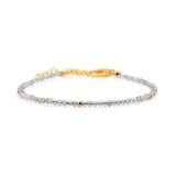 Dainty gray moonstone bracelet with silver spacer beads and gold accent, perfect for spiritual growth and elegance.