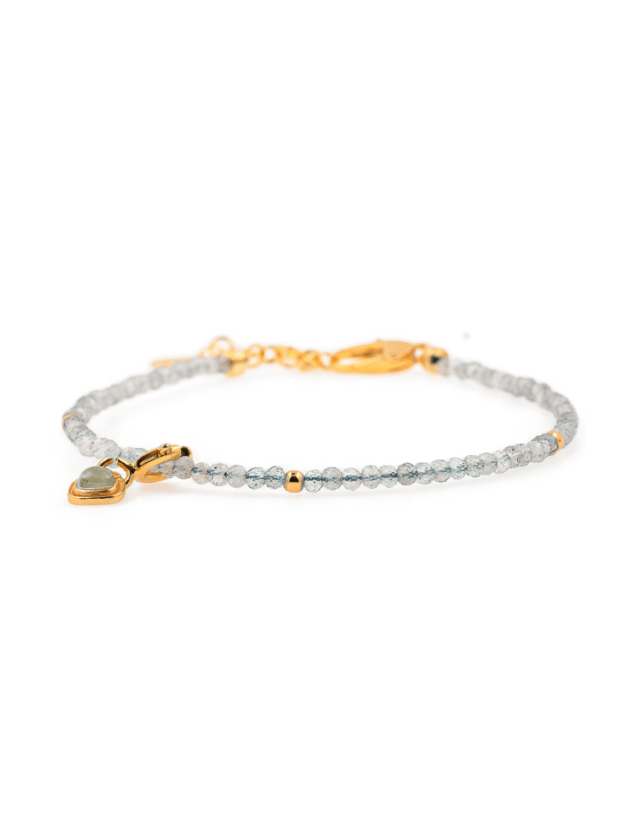 Gray Moonstone dainty bracelet with silver spacer beads and Tourmaline charm, symbolizing emotional healing and intuition.
