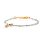 Gray Moonstone dainty bracelet with silver spacer beads and Tourmaline charm, symbolizing emotional healing and intuition.