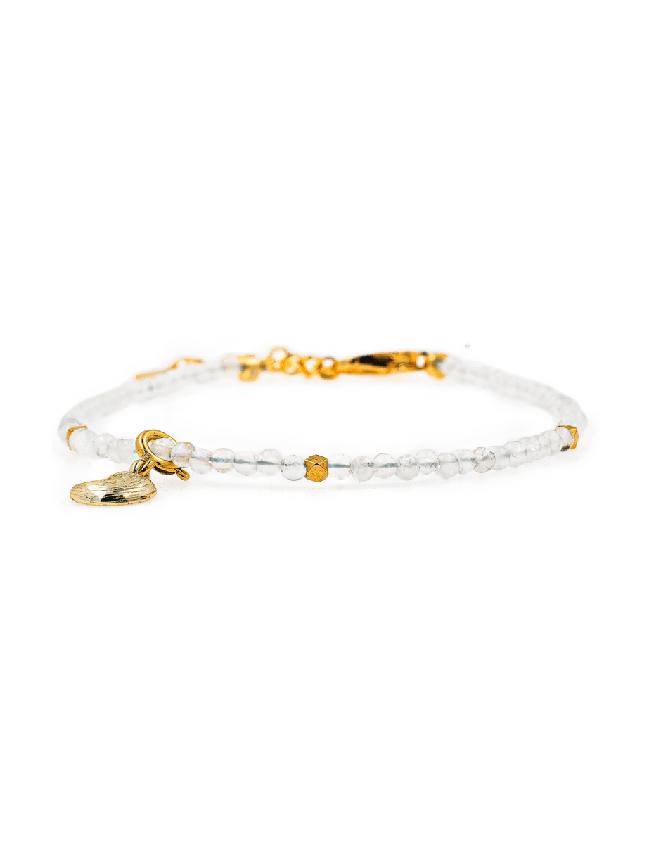 Dainty Moonstone bracelet with silver spacer bead and moon charm for emotional healing and intuition enhancement.