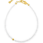 Dainty white crystal bracelet with gold clasp and bead for elegant style and personal growth.