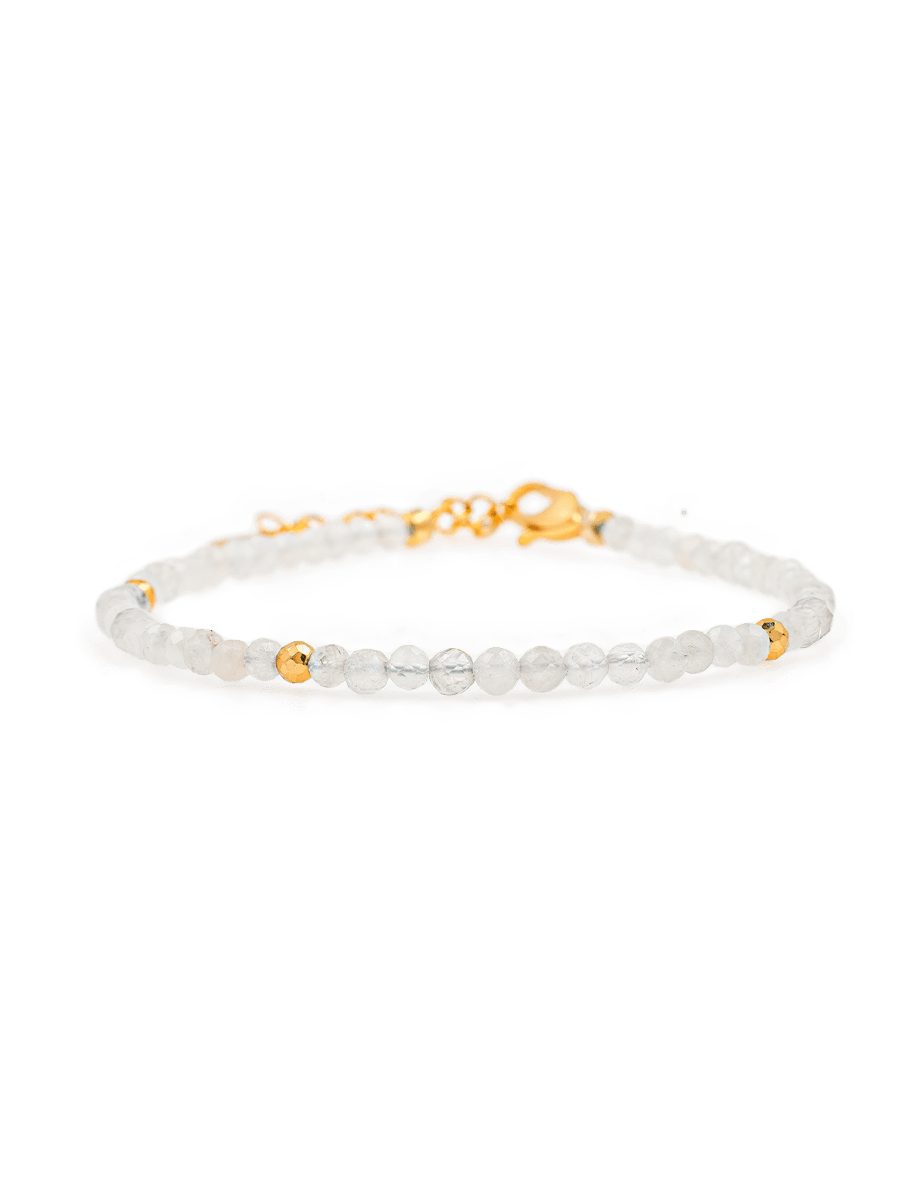 Healing Moonstone dainty bracelet with gold spacer beads, promoting emotional healing and personal growth.