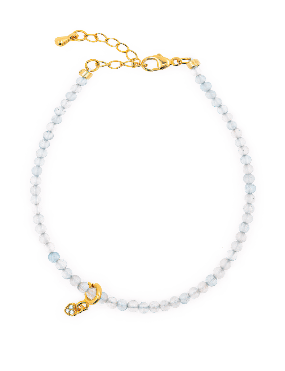 Health Aquamarine dainty bracelet featuring a heart charm, promoting peace and emotional healing.