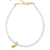 Health Aquamarine dainty bracelet featuring a heart charm, promoting peace and emotional healing.