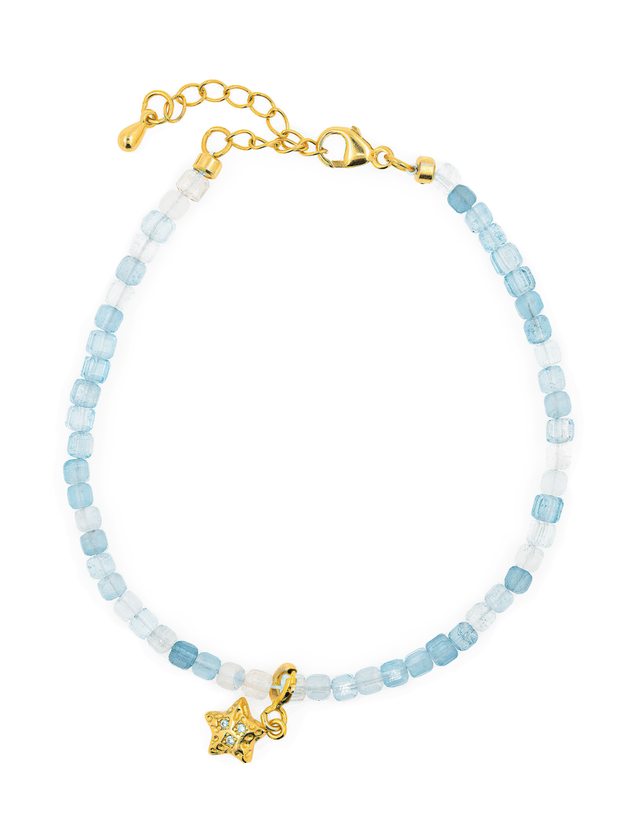 Aquamarine faceted bracelet with star charm, handcrafted in 925 sterling silver, promoting peace and clarity.