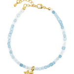 Aquamarine faceted bracelet with star charm, handcrafted in 925 sterling silver, promoting peace and clarity.