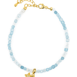 Aquamarine faceted bracelet with star charm, handcrafted in 925 sterling silver, promoting peace and clarity.