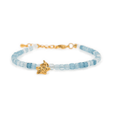 Aquamarine faceted bracelet with gold star charm, symbolizing peace and guidance. Handcrafted, elegant design, 3x3mm beads.