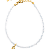Aquamarine faceted dainty bracelet with gold ice cream charm for tranquility and emotional healing.