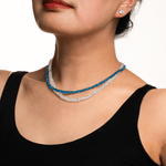 Model showcasing a Health Blue Apatite Dainty Necklace with a 925 sterling silver clasp, emphasizing energy and creativity.
