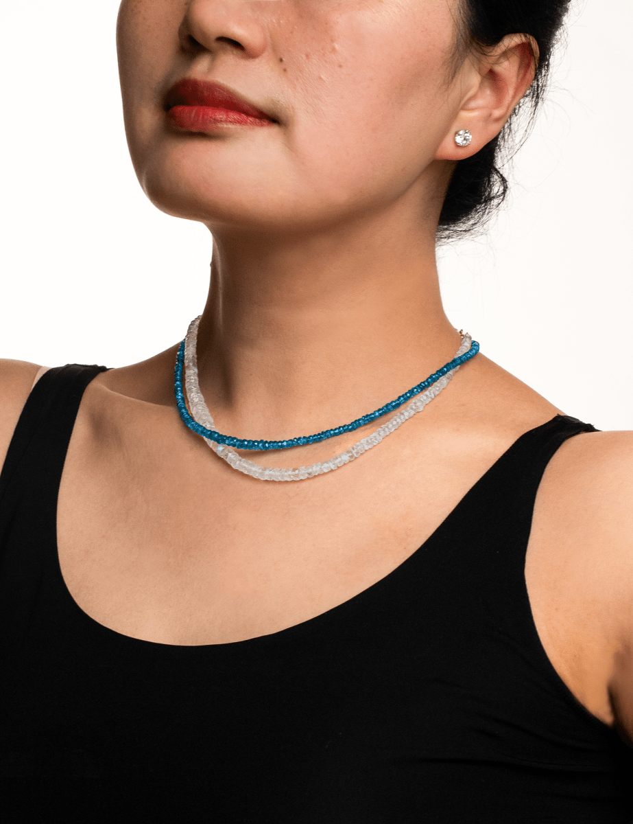 Model showcasing a Health Blue Apatite Dainty Necklace with a 925 sterling silver clasp, emphasizing energy and creativity.