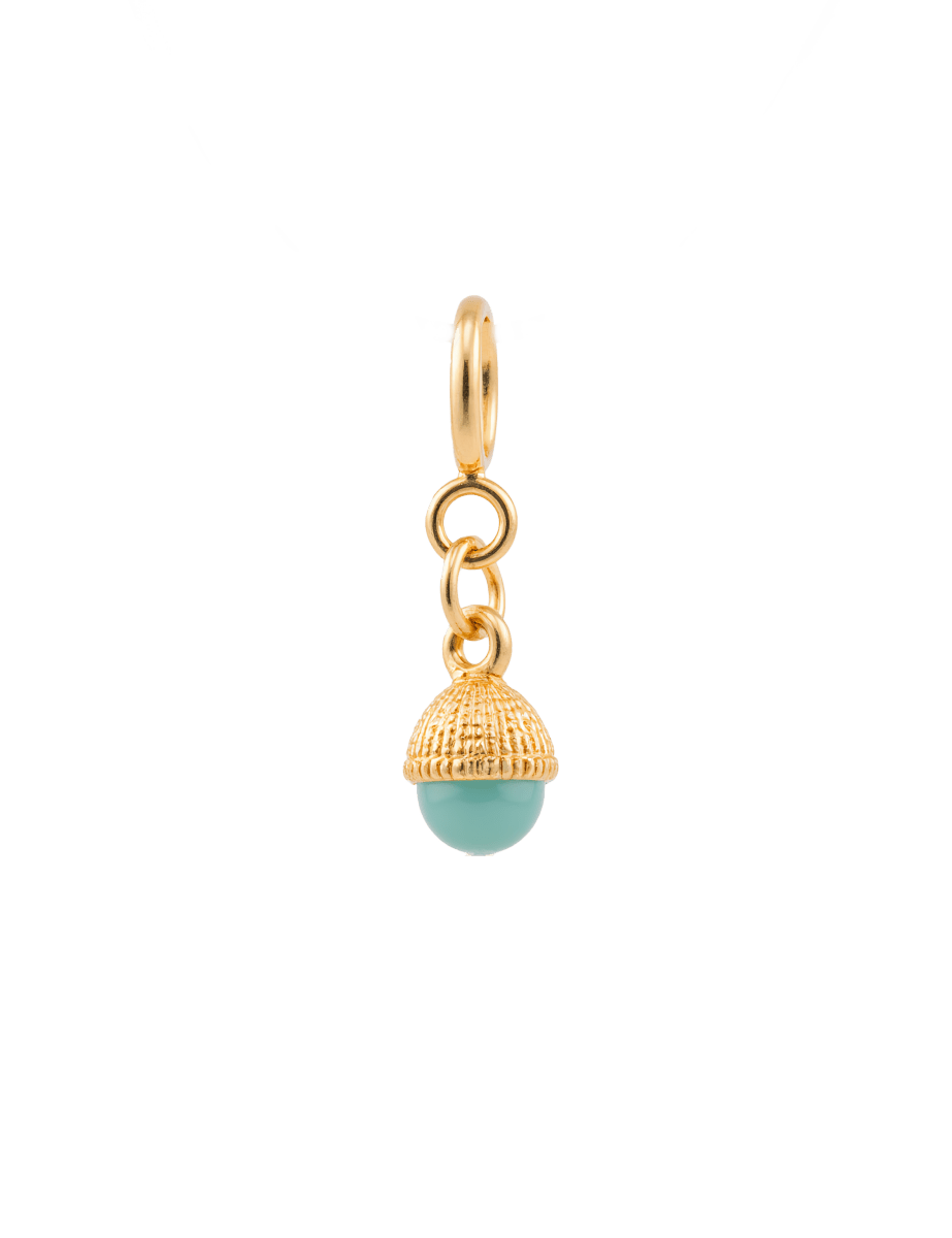 Green half-circle bead charm with gold accents, symbolizing vitality and balance in a decorative design.