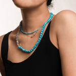 Model wearing a Health Green Turquoise Faceted Dainty Necklace alongside a complementary necklace, showcasing its vibrant hues.
