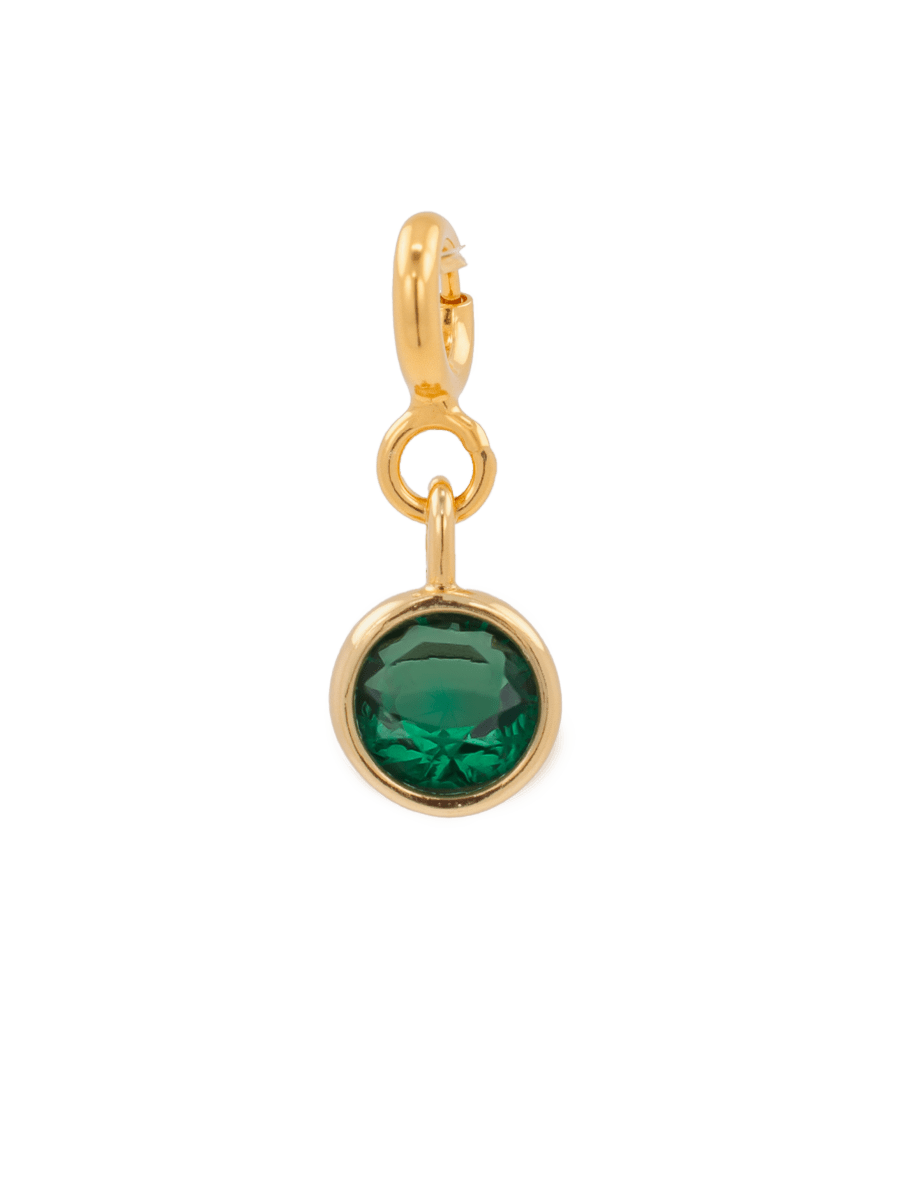 Green zircon charm in gold setting, promoting health and vitality, perfect for Taurus and enhancing well-being.