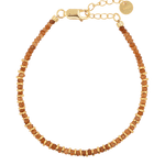 Joyful orange sapphire beaded bracelet with gold-plated sterling silver spacer beads, perfect for stacking or solo wear.
