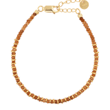 Joyful orange sapphire beaded bracelet with gold-plated sterling silver spacer beads, perfect for stacking or solo wear.