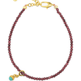 Love Garnet Dainty Bracelet with Turquoise Charm, featuring 925 sterling silver clasp and vibrant garnet beads.