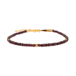 Dainty garnet bracelet with gold spacer beads, symbolizing love and emotional healing.